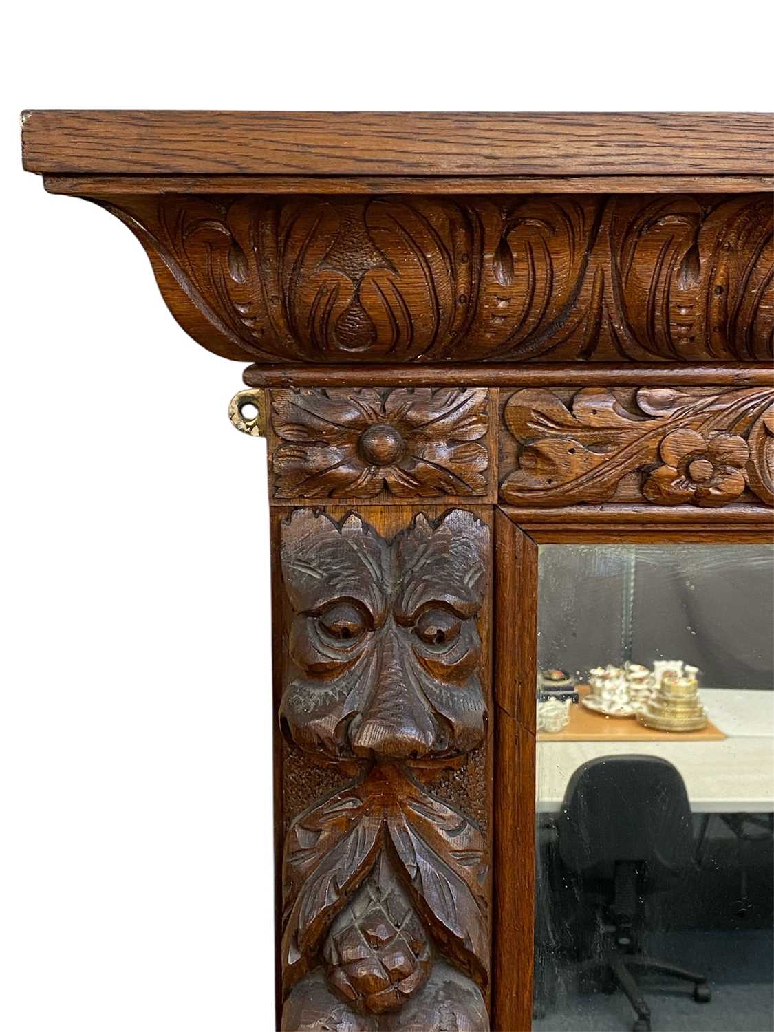 massive oak framed overmantel mirror, moulded cornice carved with leaves, surround deeply carved massive oak framed overmantel mirror, moulded cornice carved with leaves, surround deeply carved