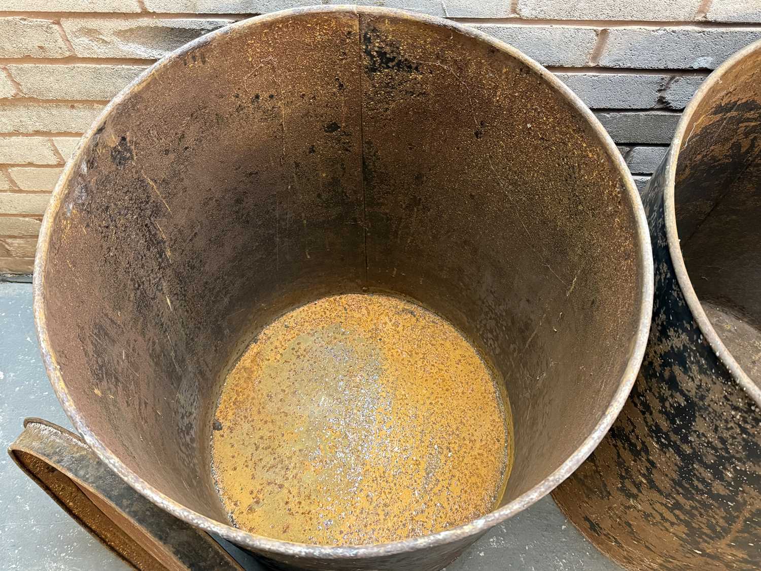 pair of vintage black japanned steel drums, numbered 1 and 2, with covers, 76 (h) x 59cms (d) pair of vintage black japanned steel drums, numbered 1 and 2, with covers, 76 (h) x 59cms (d)