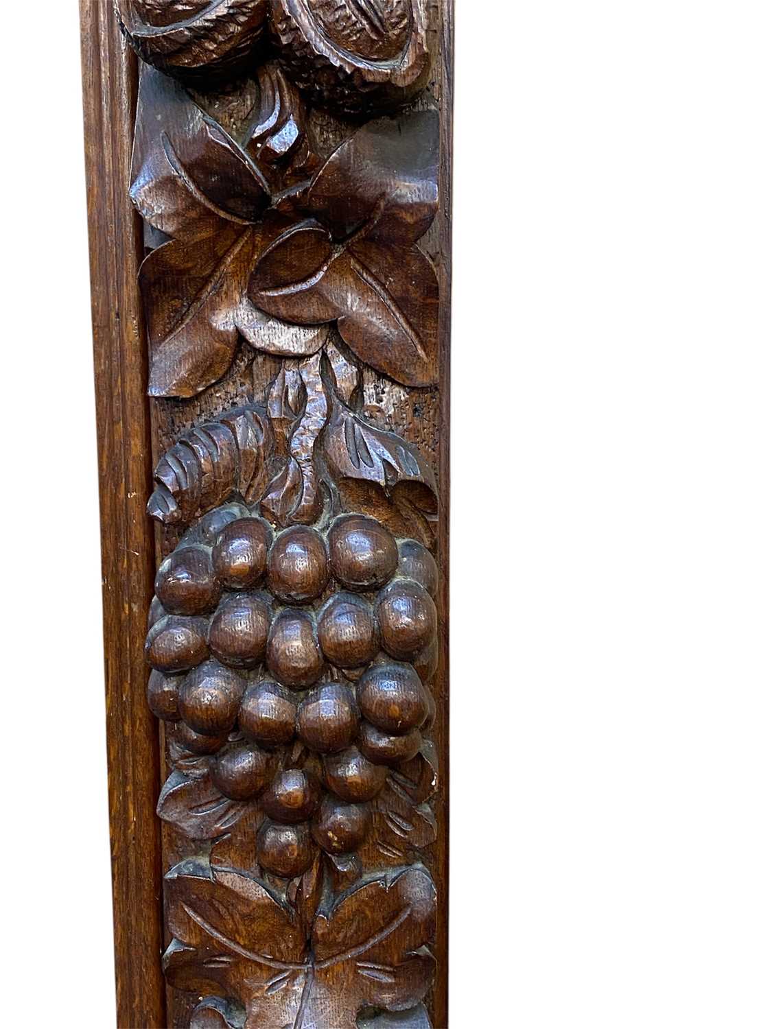 massive oak framed overmantel mirror, moulded cornice carved with leaves, surround deeply carved massive oak framed overmantel mirror, moulded cornice carved with leaves, surround deeply carved