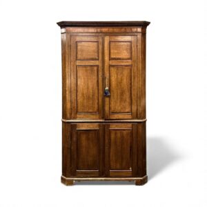 antique oak freestanding corner cupboard, cross banded in mahogany, moulded dentil cornice over four