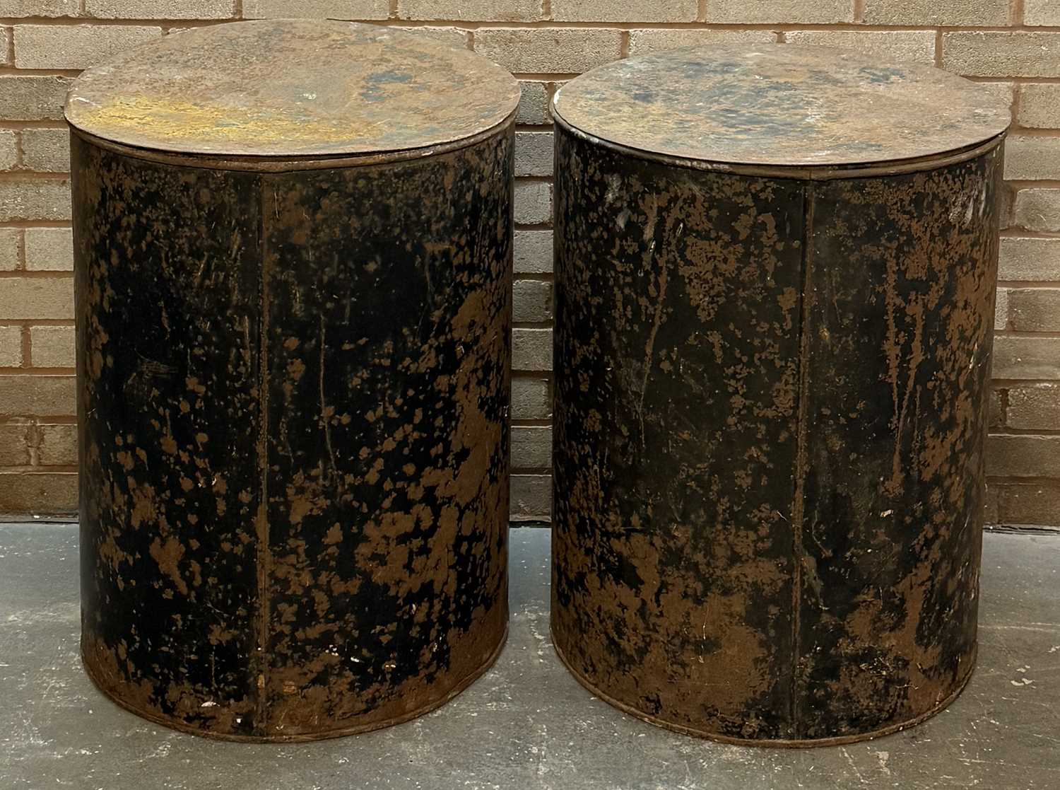 pair of vintage black japanned steel drums, numbered 1 and 2, with covers, 76 (h) x 59cms (d) pair of vintage black japanned steel drums, numbered 1 and 2, with covers, 76 (h) x 59cms (d)
