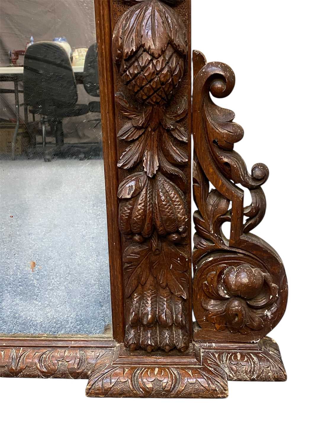 massive oak framed overmantel mirror, moulded cornice carved with leaves, surround deeply carved massive oak framed overmantel mirror, moulded cornice carved with leaves, surround deeply carved