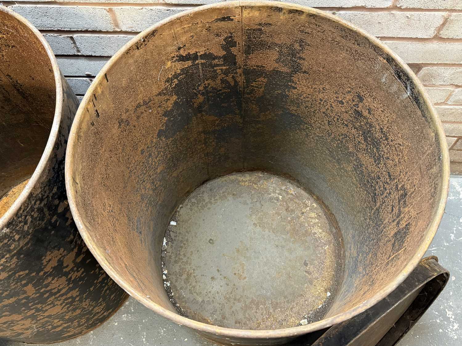 pair of vintage black japanned steel drums, numbered 1 and 2, with covers, 76 (h) x 59cms (d) pair of vintage black japanned steel drums, numbered 1 and 2, with covers, 76 (h) x 59cms (d)