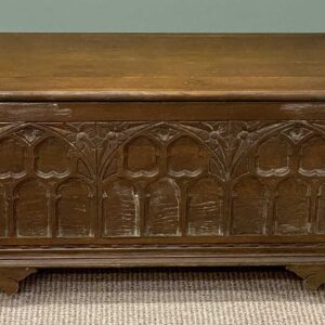 small gothic oak style blanket chest, arched carved panelled front, 47 (h) x 94 (w) x 38cms (d)