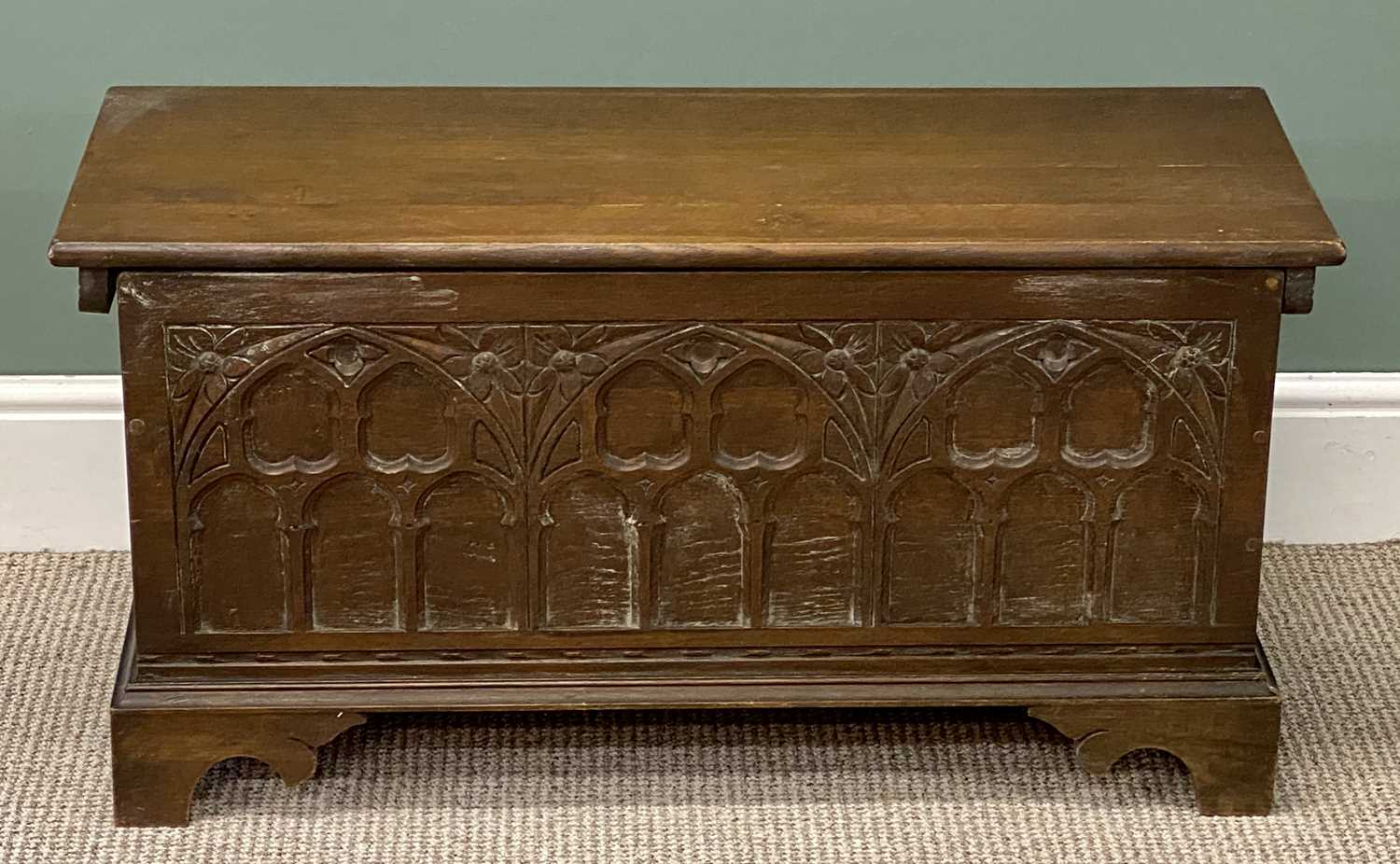 small gothic oak style blanket chest, arched carved panelled front, 47 (h) x 94 (w) x 38cms (d) small gothic oak style blanket chest, arched carved panelled front, 47 (h) x 94 (w) x 38cms (d)