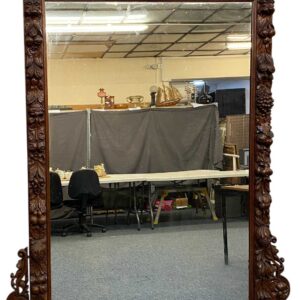 massive oak framed overmantel mirror, moulded cornice carved with leaves, surround deeply carved