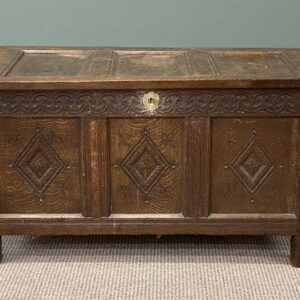 antique joined oak coffer, cross banded hinged top over triple panel front and two drawers, turned